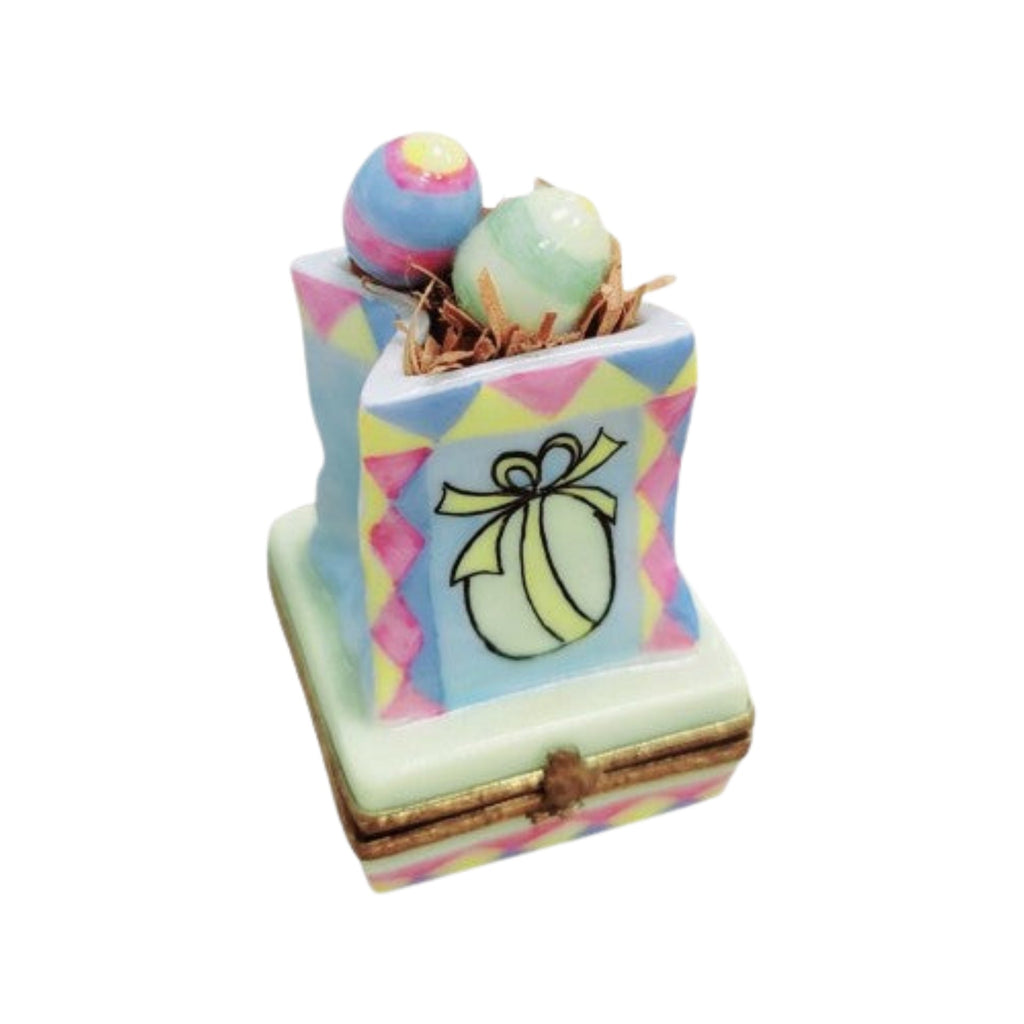 Easter Bag w Eggs Bird Figurine Limoges Box Keepsake, a hand-painted Limoges porcelain gift