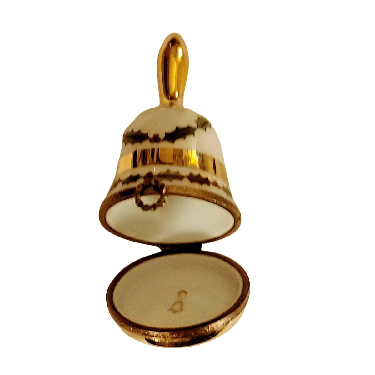 Fine French craftsmanship on the 1993 Christmas Bell Limoges box, painted by hand