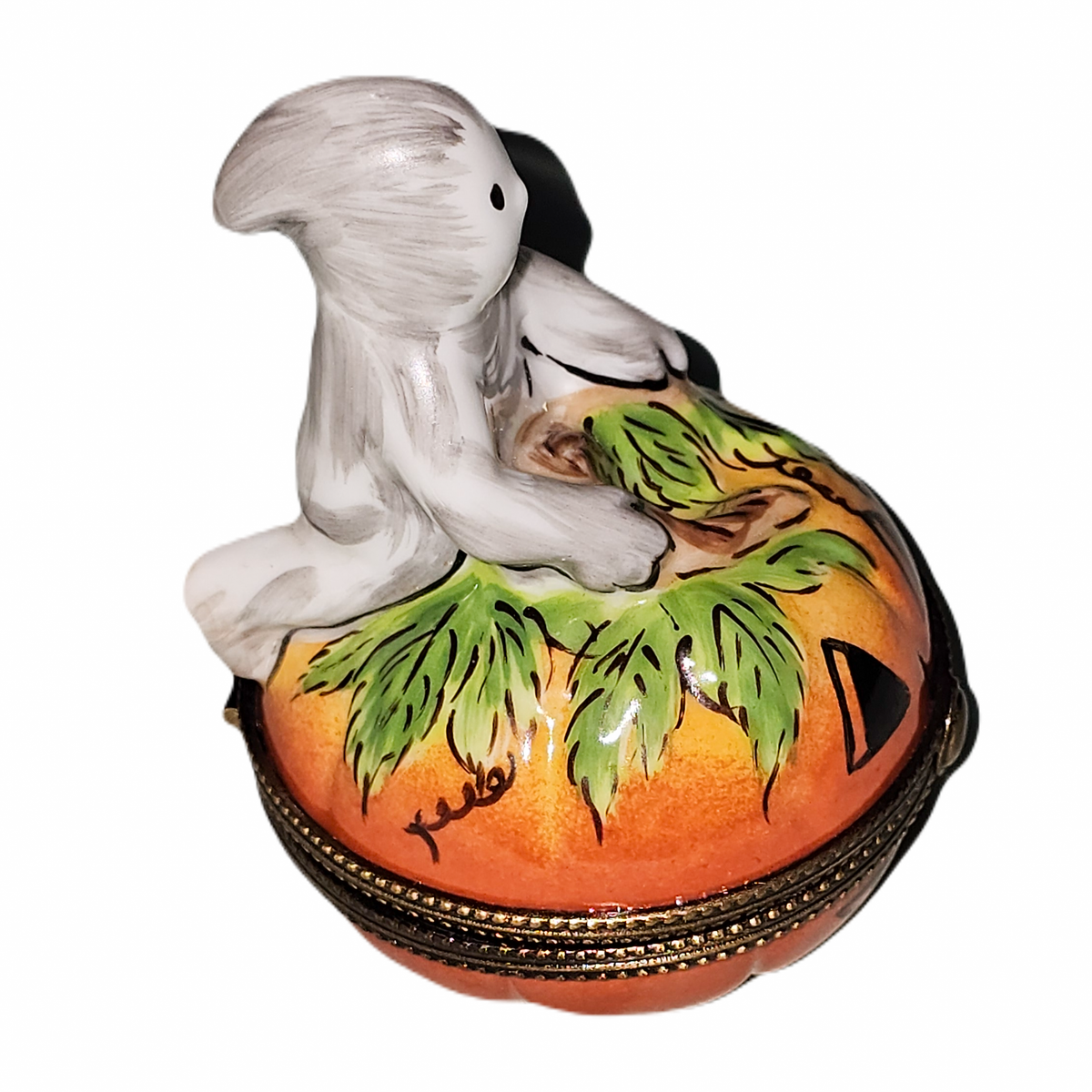 Fine art lovers will admire this Ghostly Pumpkin Limoges box