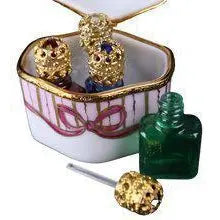 Odd Shape 4 Perfume Bottles Limoges box, an heirloom-quality piece for collectors