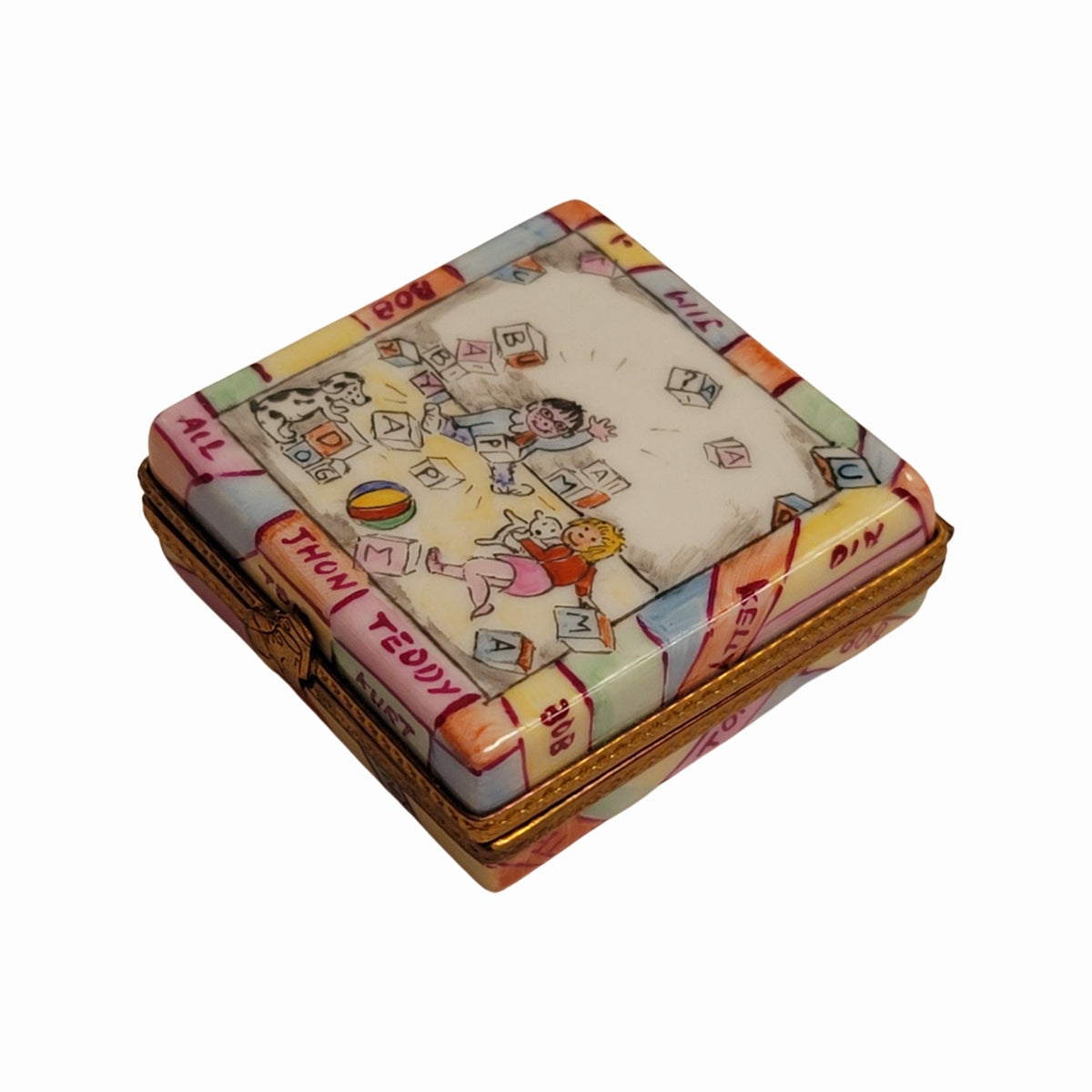 Painted details on the Baby Blocks Baby Limoges box, French art in miniature
