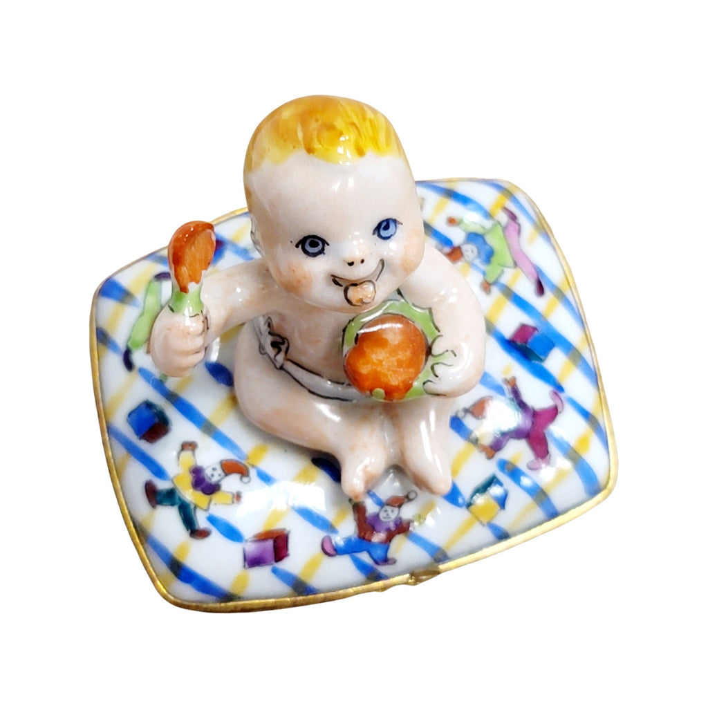 Baby Eating on Pillow Limoges Box Figurine French Gift, a hand-painted Limoges porcelain gift