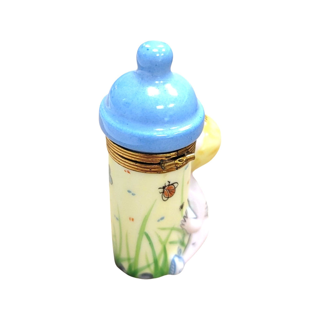 Baby w Blue Bottle Limoges Box Figurine, view 3
