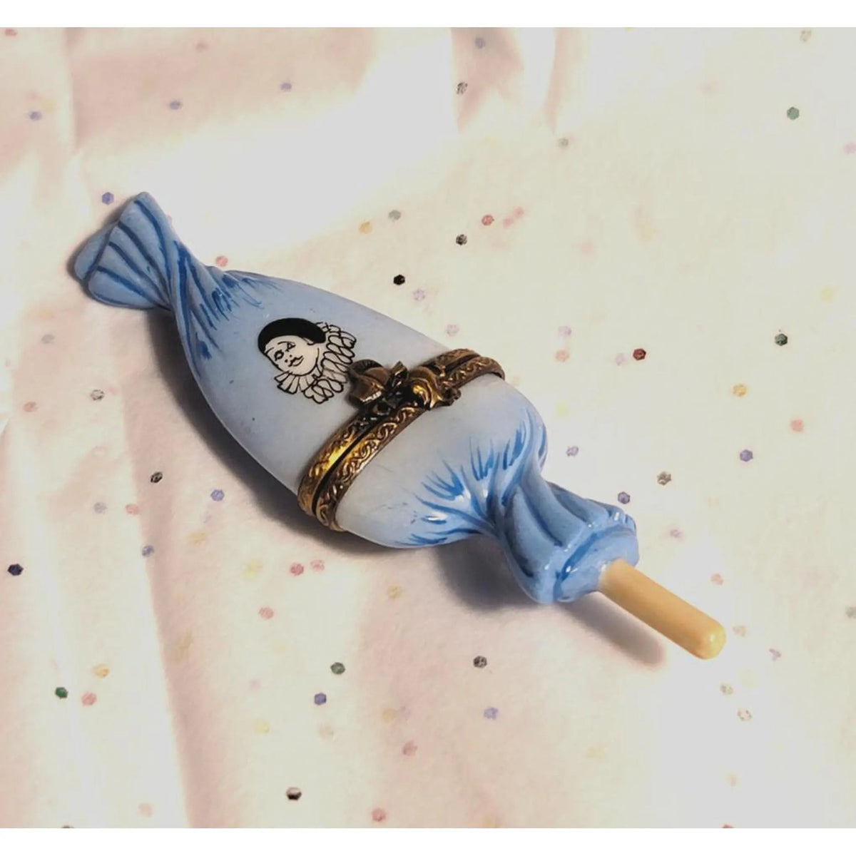 Painted details on the Sweet Candy Lollipop Blue Clown Wrapping Limoges box, French art in miniature