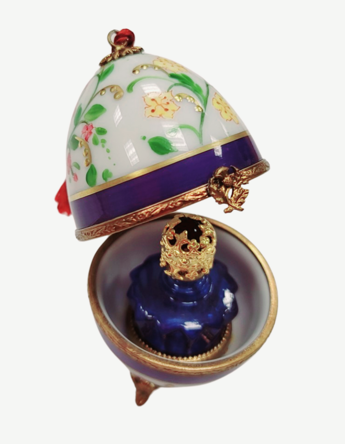 Fine French craftsmanship on the Blue Flowers Egg with Perfume Limoges box, painted by hand