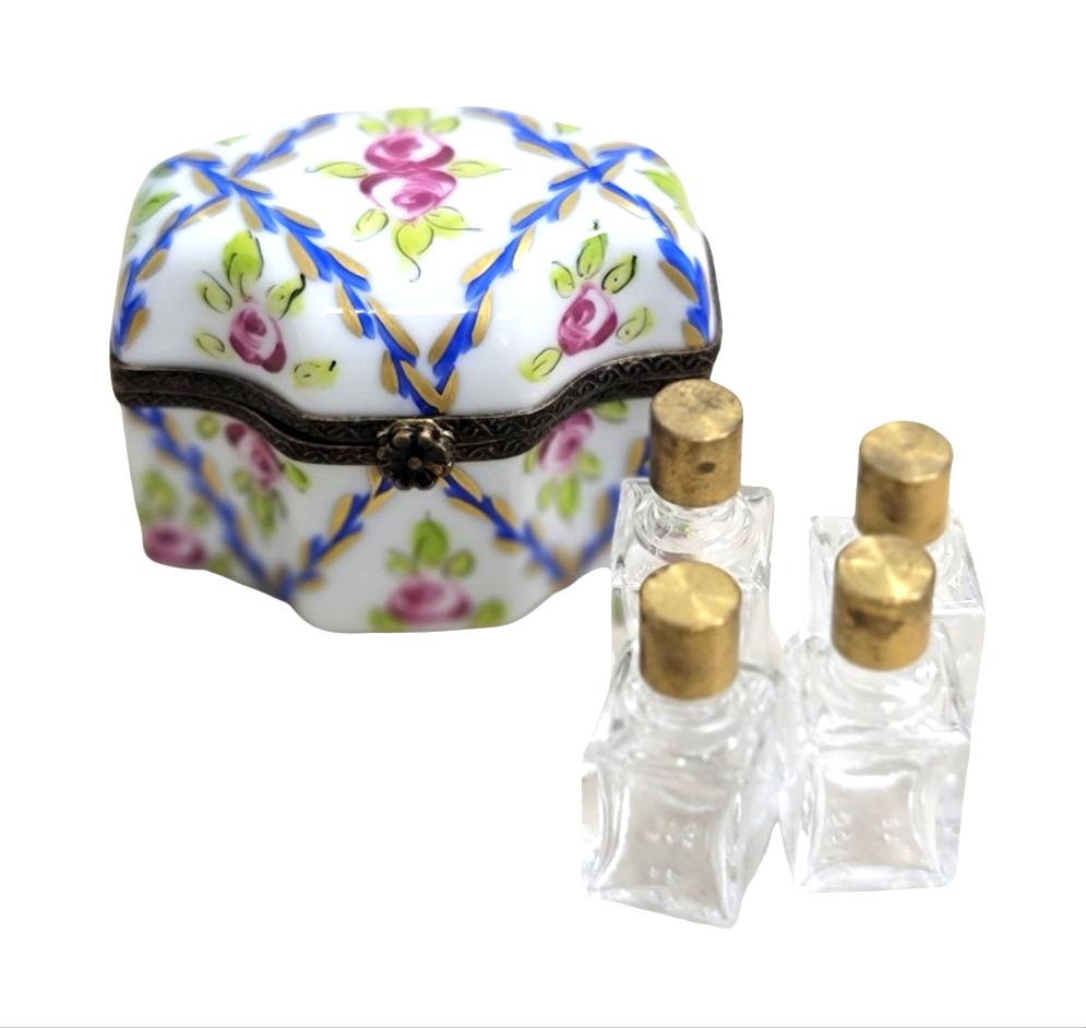 Limoges Boutique presents the 4 Perfume Roses Blue, a genuine Limoges box painted by hand in France
