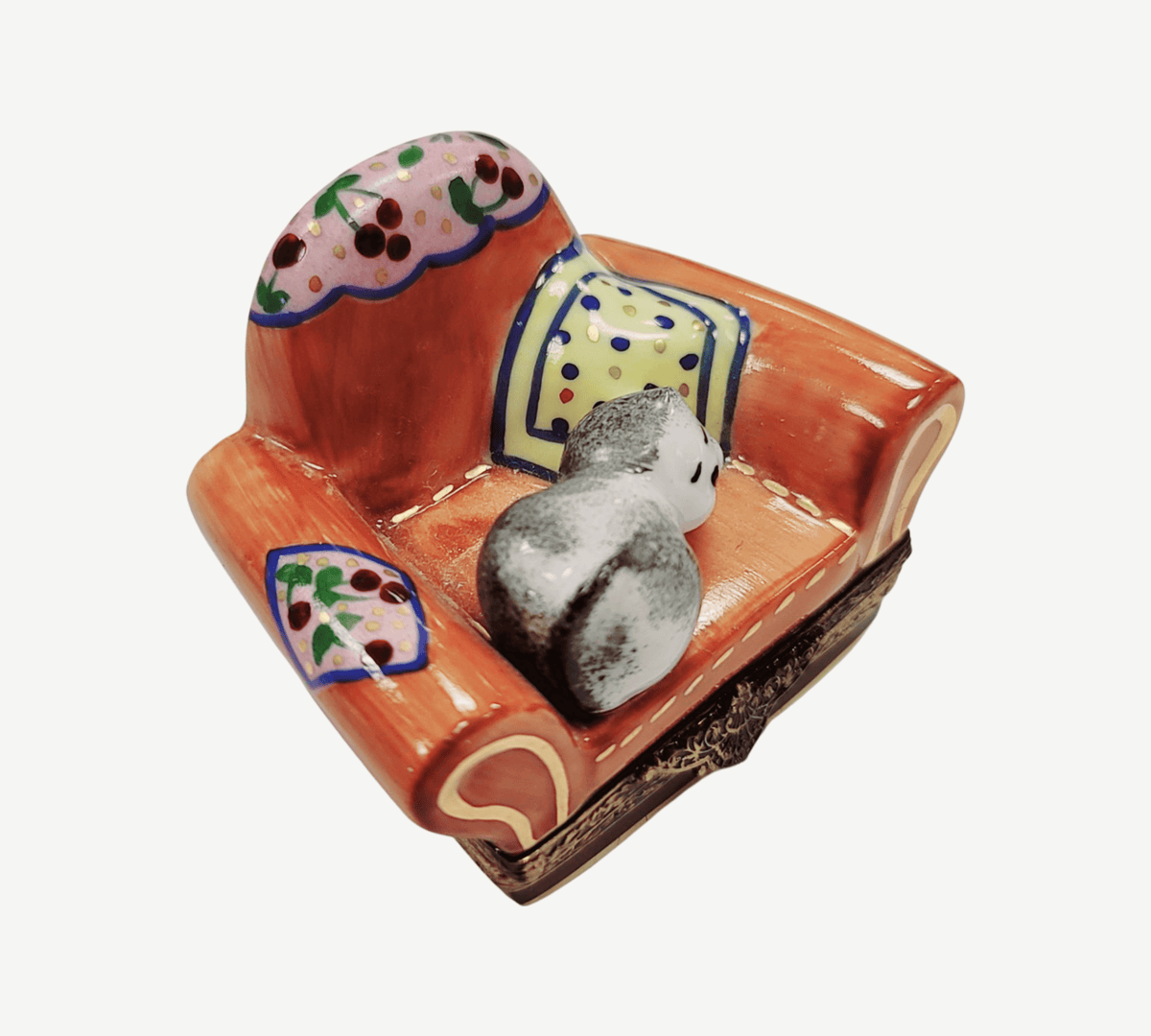 Artisan-painted Cat in Arm Chair Limoges box from France, a cherished collectible