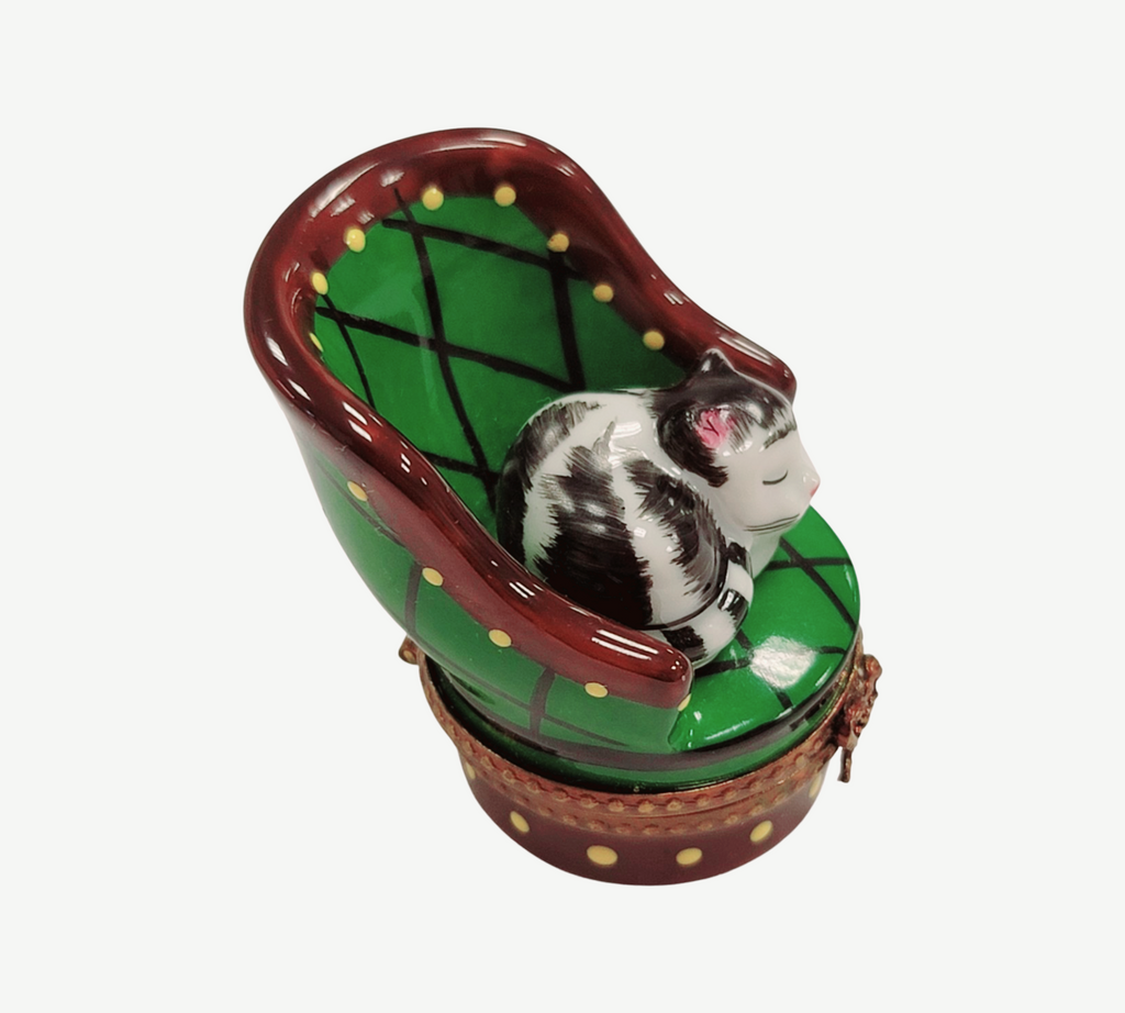 Artisan-painted Cat in Green Chair Limoges box from France, a cherished collectible