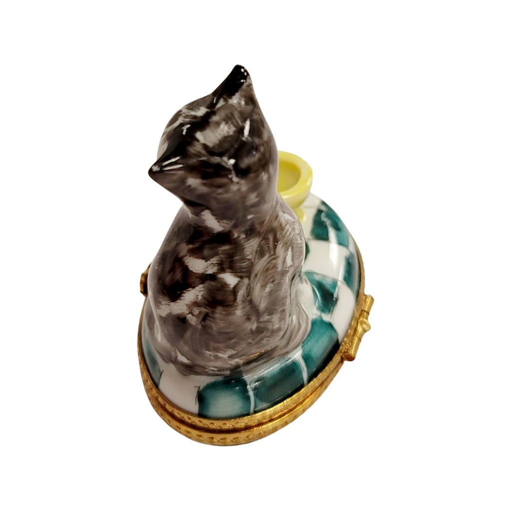 Fine French craftsmanship on the Cat with Yellow Cup Teacup Limoges box, painted by hand