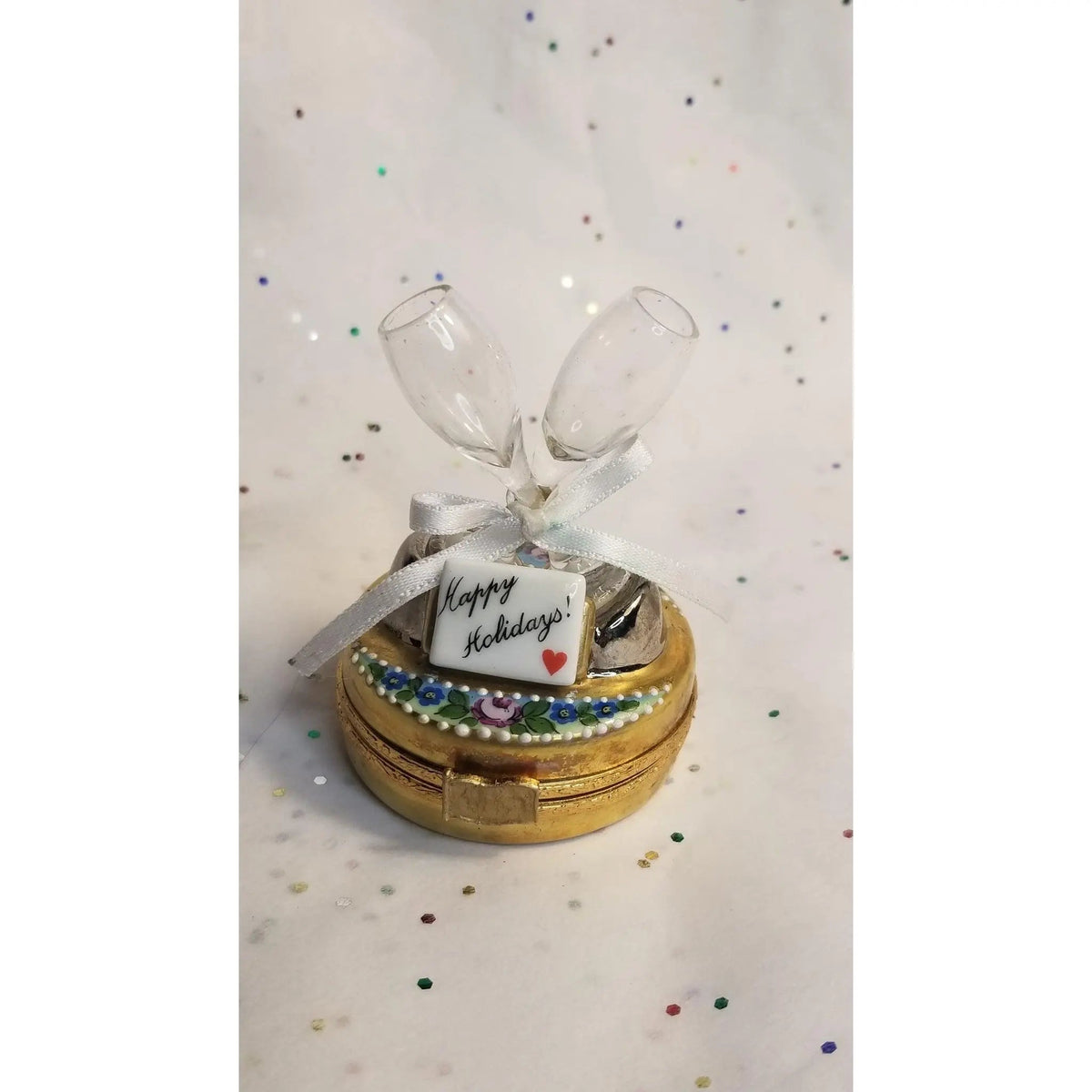 Fine French craftsmanship on the Happy Holidays Champagne Glasses Set Limoges box, painted by hand