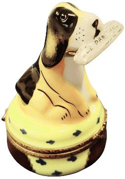 Every brushstroke by hand on the Dog with Newspaper Limoges box from France