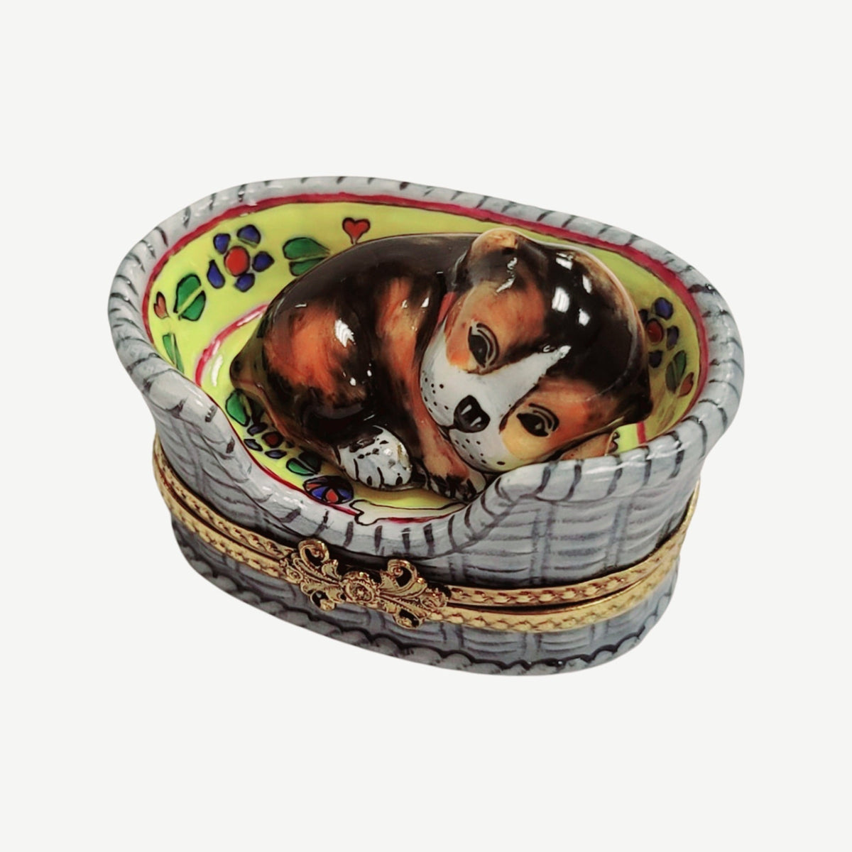 Fine French craftsmanship on the Dog in Basket Limoges box, painted by hand