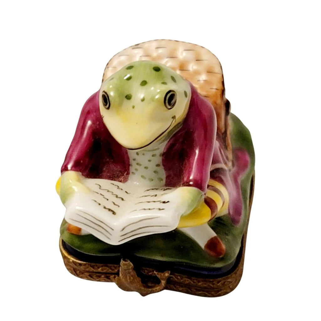 Fine art lovers will admire this Frog Reading on Chair Limoges box