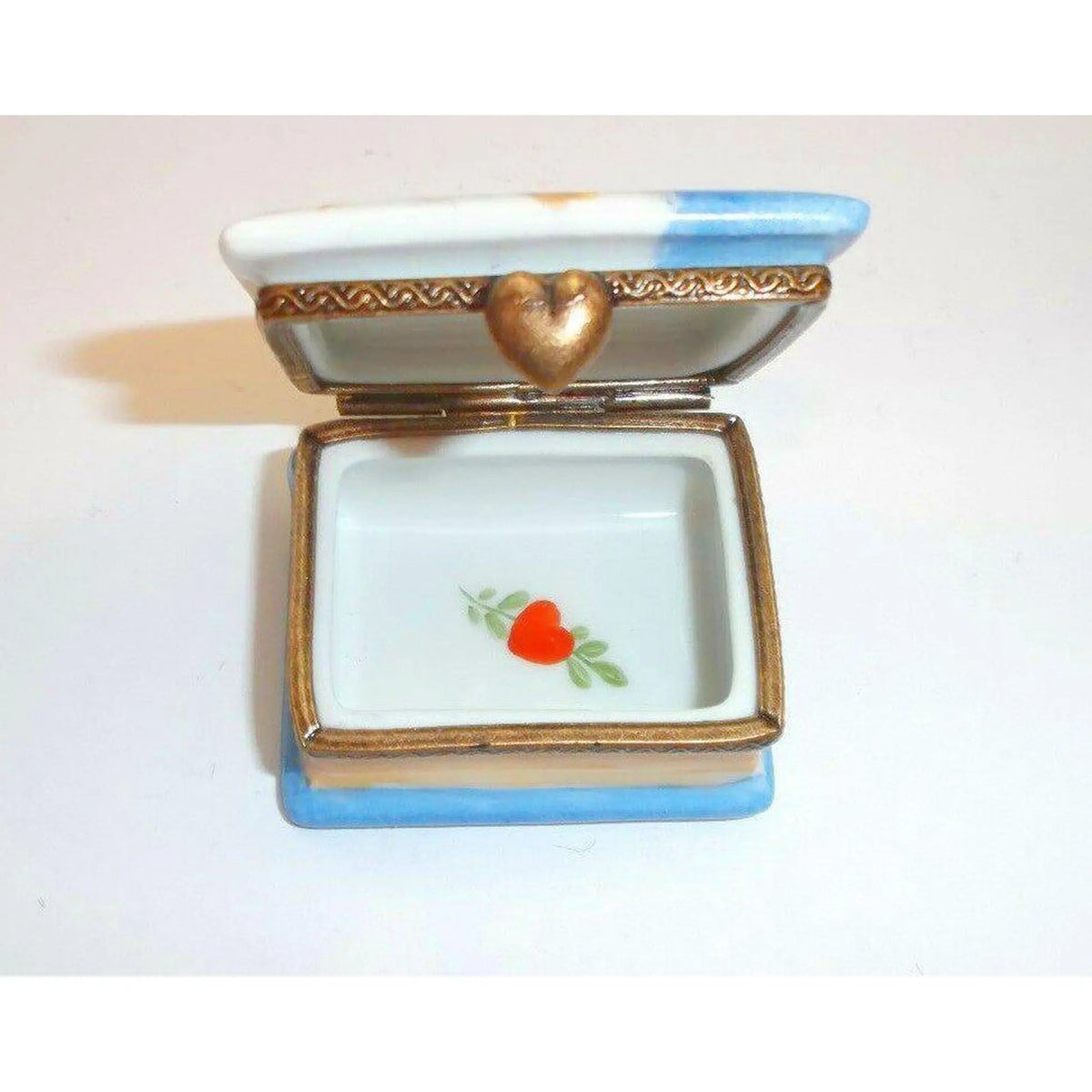 Cherub Book Lyre Music Lyrics Limoges box, an heirloom-quality piece for collectors