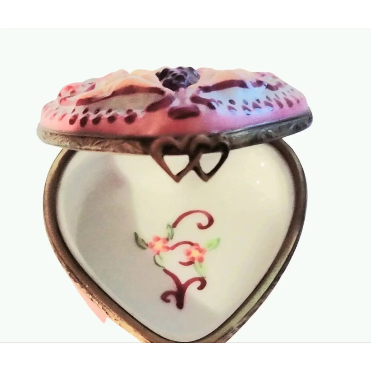 Every brushstroke by hand on the Happy Anniversary Cherubs Heart Limoges box from France