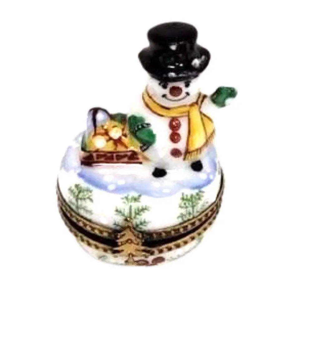 Limoges Boutique presents the Christmas Snowman Waving, a genuine Limoges box painted by hand in France