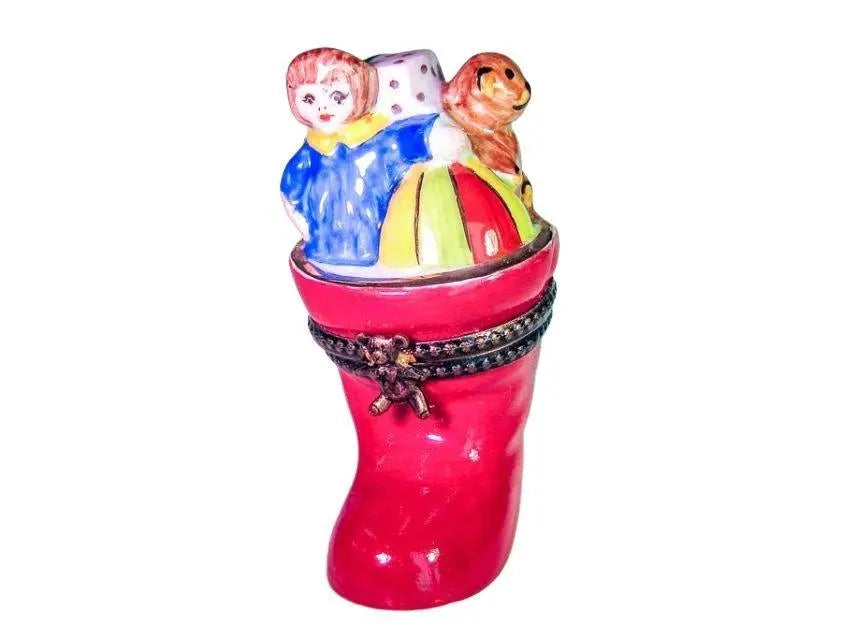 Limoges Boutique presents the Christmas Stocking Boot, a genuine Limoges box painted by hand in France