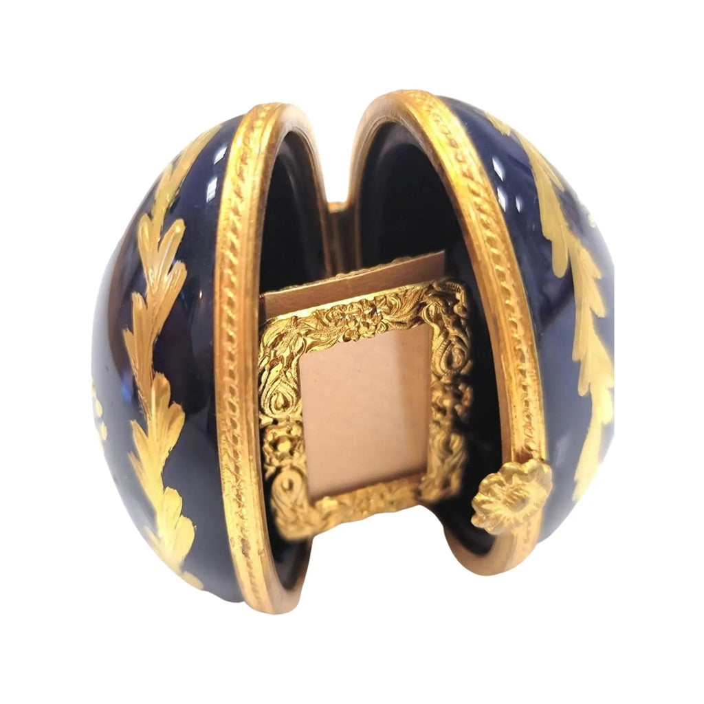 Limoges Boutique presents the Cobalt Blue Gold Egg Oval Picture Frame Vert, a genuine Limoges box painted by hand in France