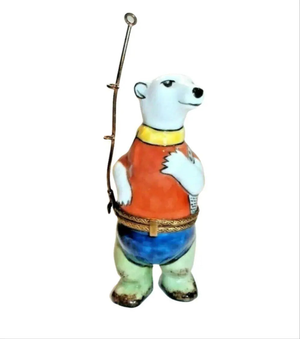 Limoges Boutique presents the La Gloriette Fishing Polar Bear Fisherman, a genuine Limoges box painted by hand in France