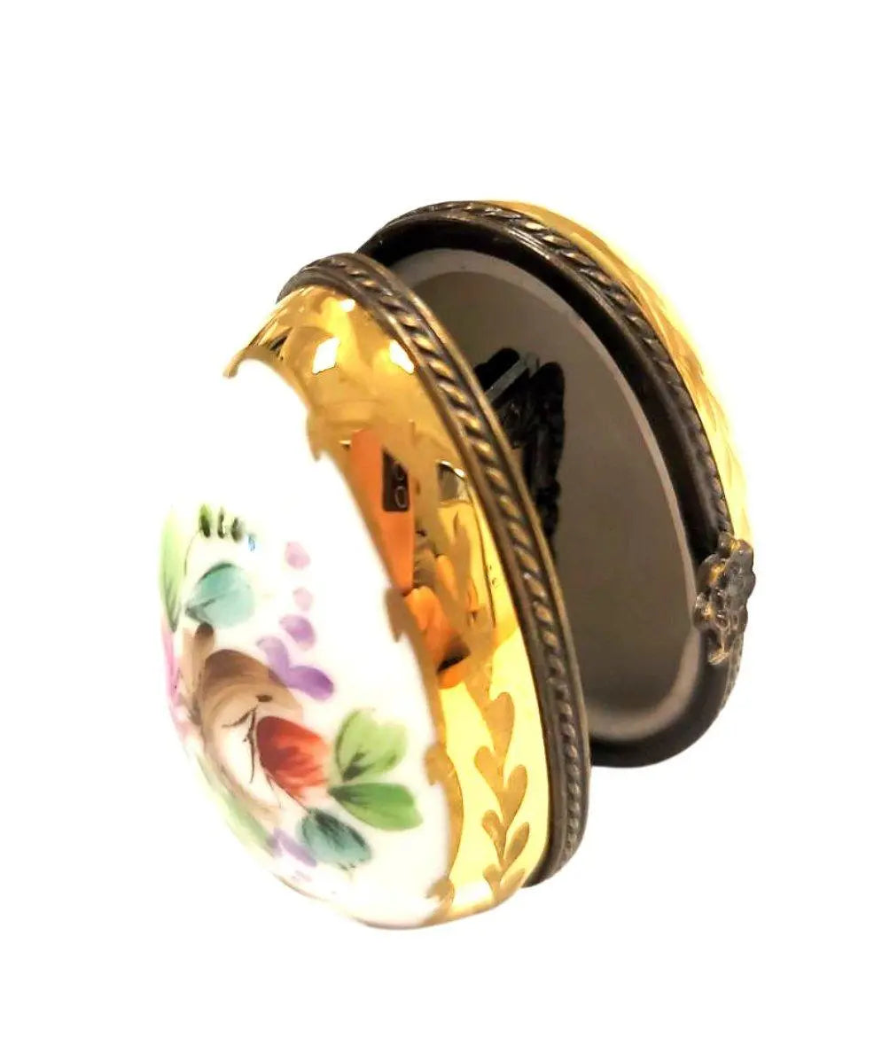 Flowered Egg Oval Picture Frame Limoges box, an heirloom-quality piece for collectors
