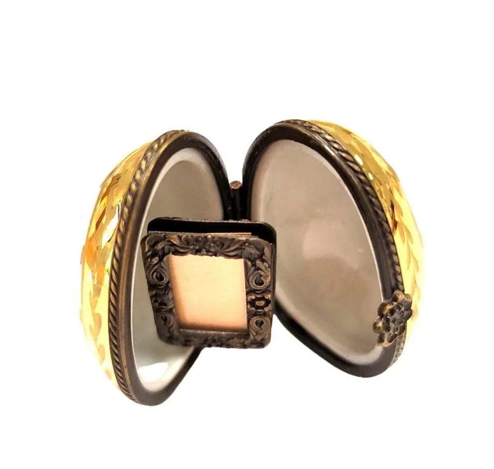 Limoges Boutique presents the Flowered Egg Oval Picture Frame, a genuine Limoges box painted by hand in France