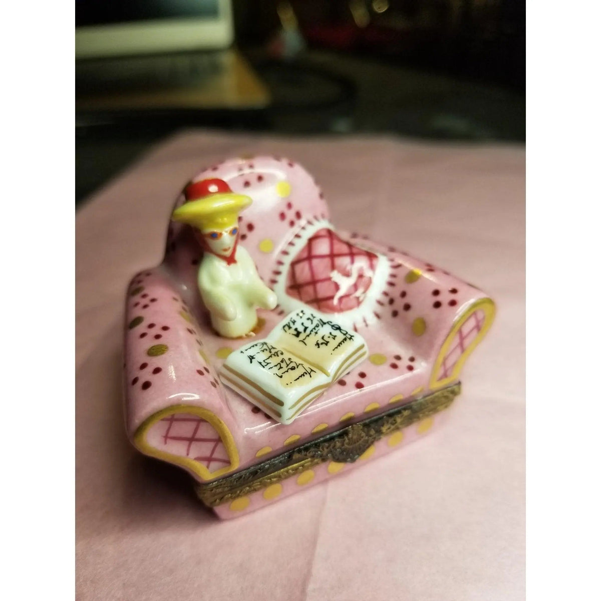 The painter's artistry shows on this Woman in Big Pink Chair No. 1 of 750 Limoges box