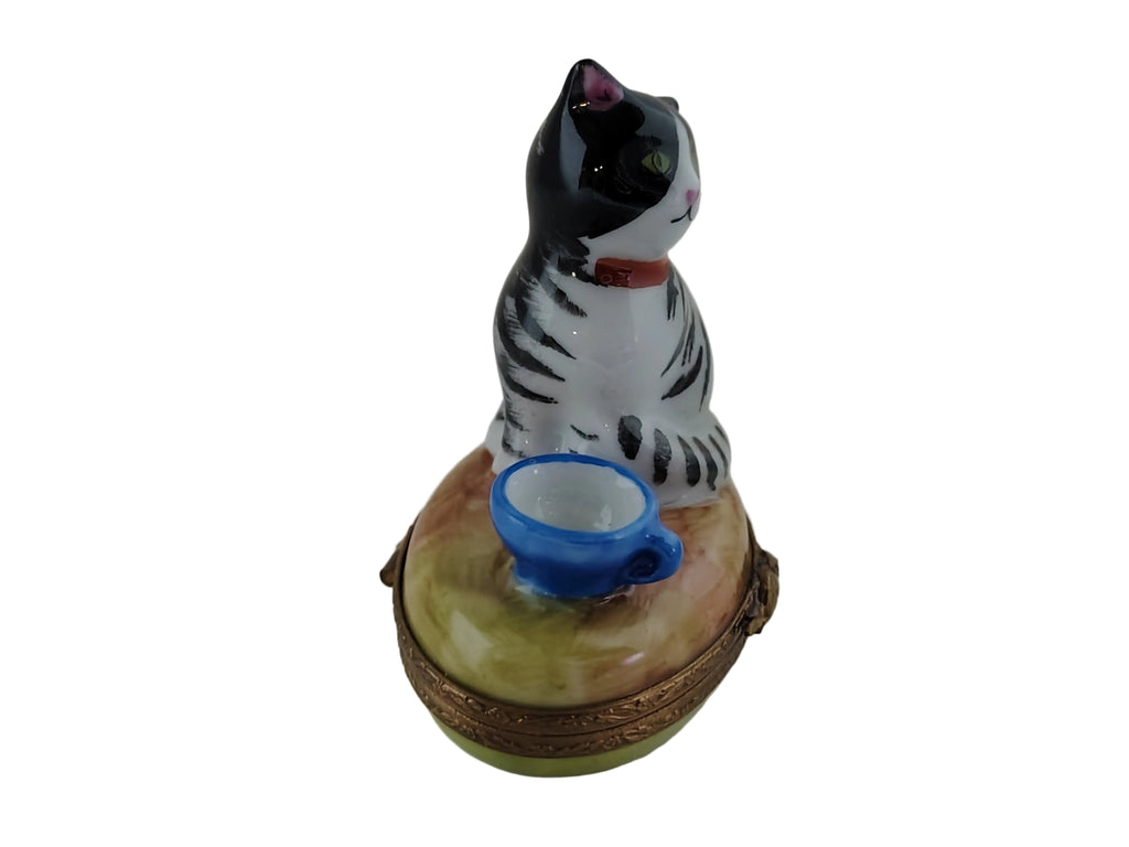 Fine art lovers will admire this Cat with Blue Cup Limoges box