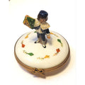 Limoges Boutique presents the Kite Boy Man, a genuine Limoges box painted by hand in France