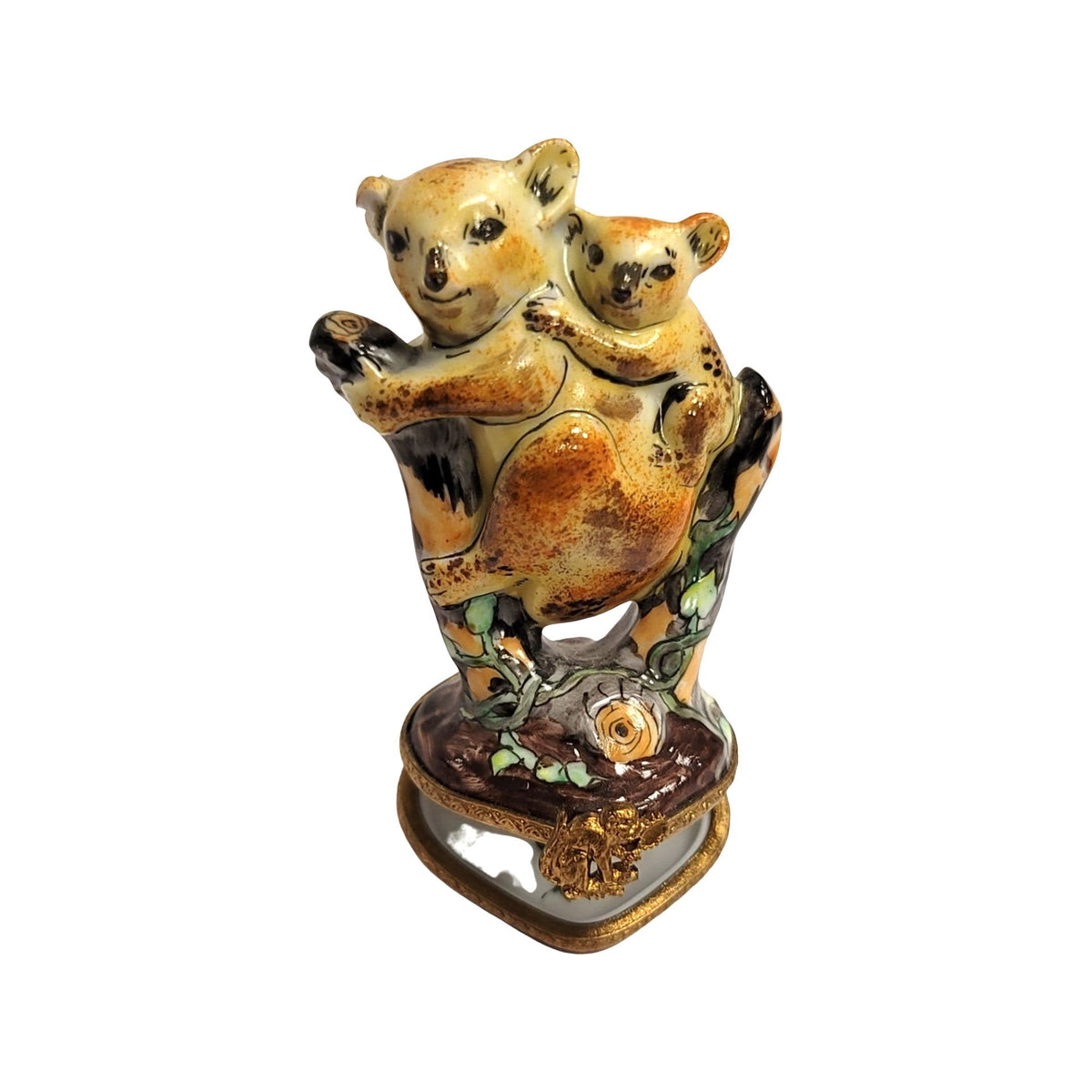 Koalas on a leafy tree trunk over a heart-shaped base, an Australian charm in Limoges porcelain
