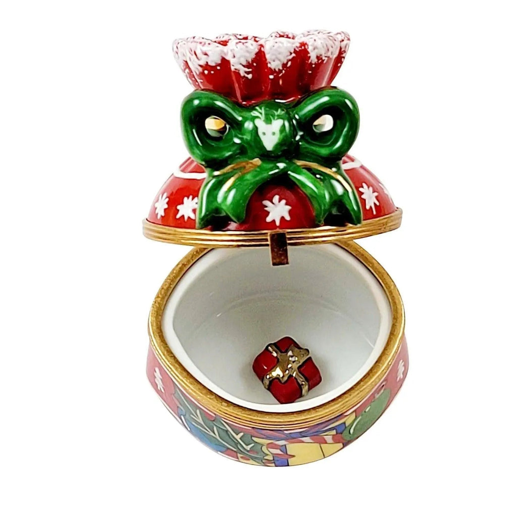 Artisan-painted Merry Christmas Bag Cheer Limoges box from France, a cherished collectible