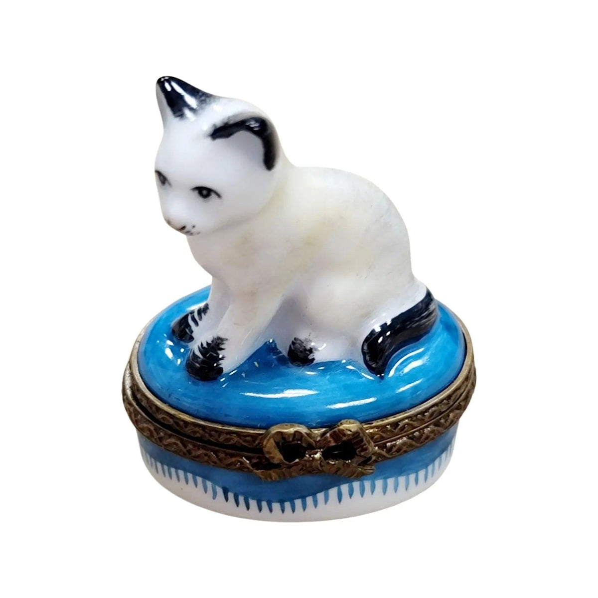 Limoges Boutique presents the Mini White Siamese Cat, a genuine Limoges box painted by hand in France