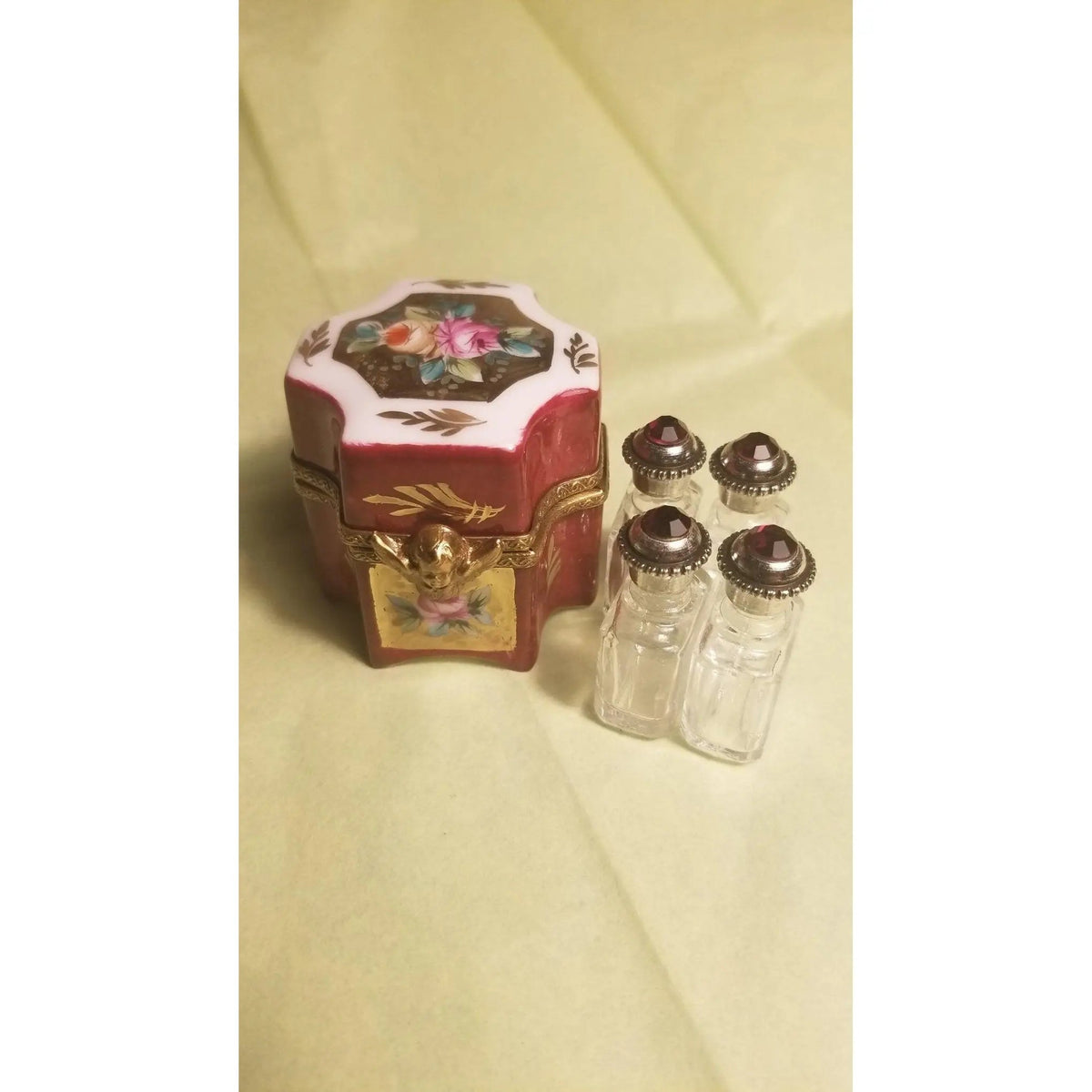 Fine French craftsmanship on the Four Perfume Octagonal Footed Limoges box, painted by hand