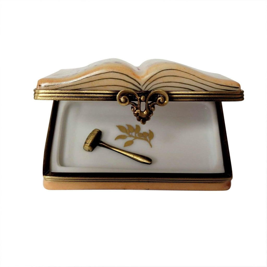 Looking inside the Open Law Book with Removable Brass Gavel Limoges box, with its hinged lid open