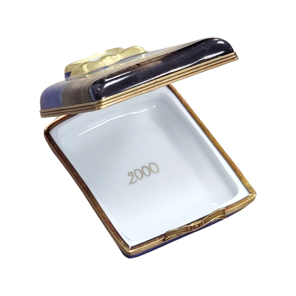 Fine French craftsmanship on the 2000 Paris Fireworks Shirt Set Limoges box, painted by hand