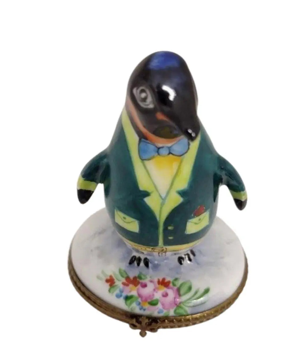 Fine art lovers will admire this Penguin with Flowers Tuxedo Limoges box