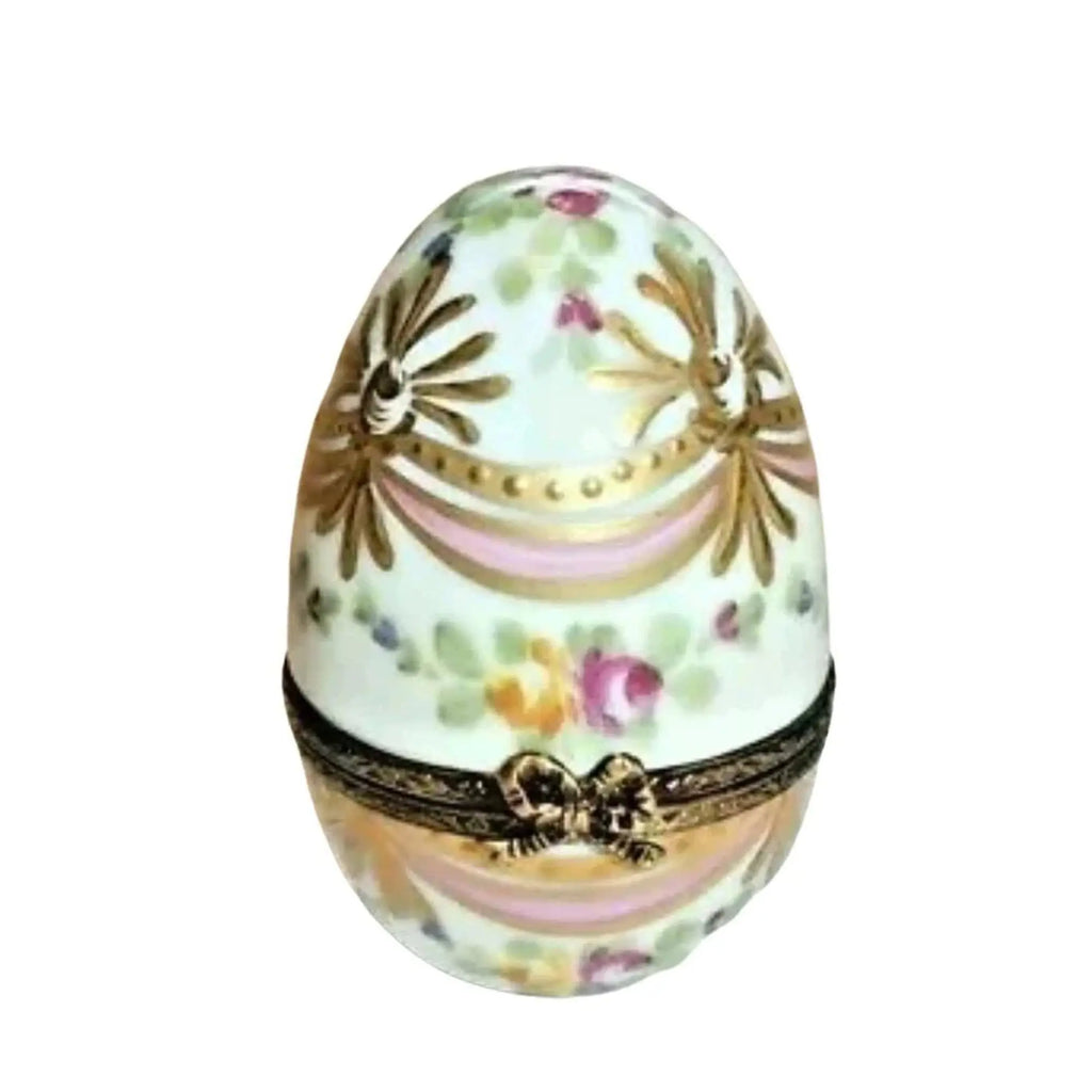 Pink Egg with Gold Ribbons Limoges box, an heirloom-quality piece for collectors