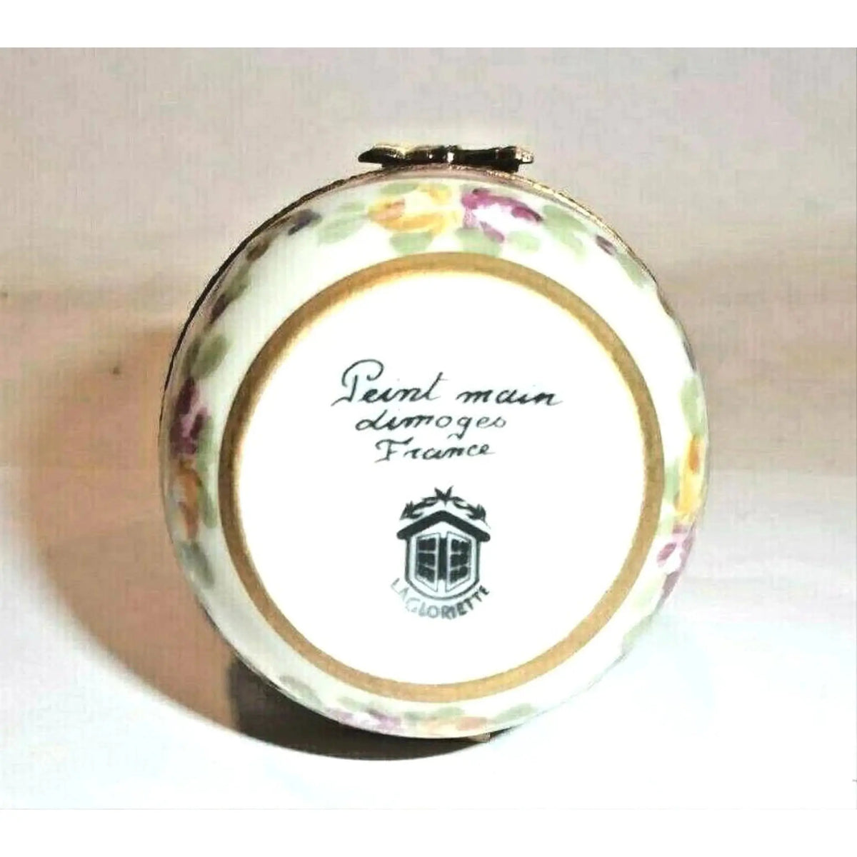 Painted details on the Pink Egg with Gold Ribbons Limoges box, French art in miniature