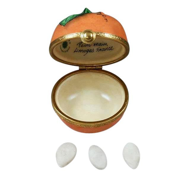 Pumpkin with Seeds Limoges box opened to show the inside, a keepsake to tuck a treasure in