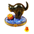 Black Cat Looking at Pumpkin with Candy Corn by Rochard, an authentic French Limoges box from Limoges Boutique