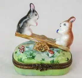 Artisan-painted Rabbit Seasaw Limoges box from France, a cherished collectible
