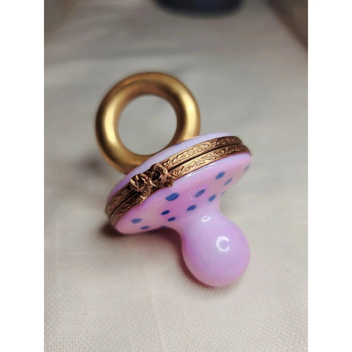 Pink Pacifier Baby Limoges box, an heirloom-quality piece for collectors