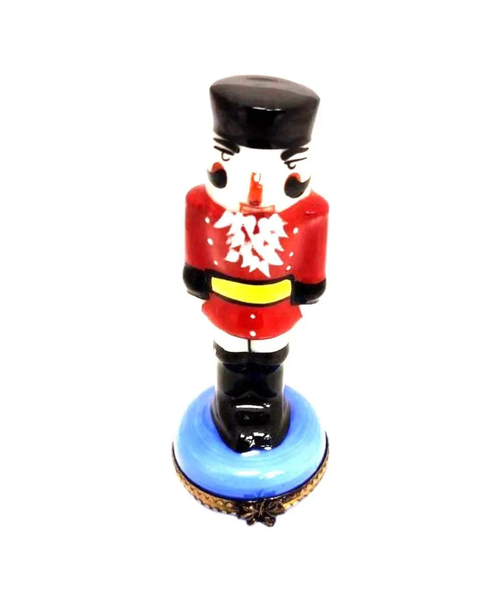 Red Nutcracker on Blue Base Limoges Box Figurine Collectible, a hand-painted Limoges porcelain gift