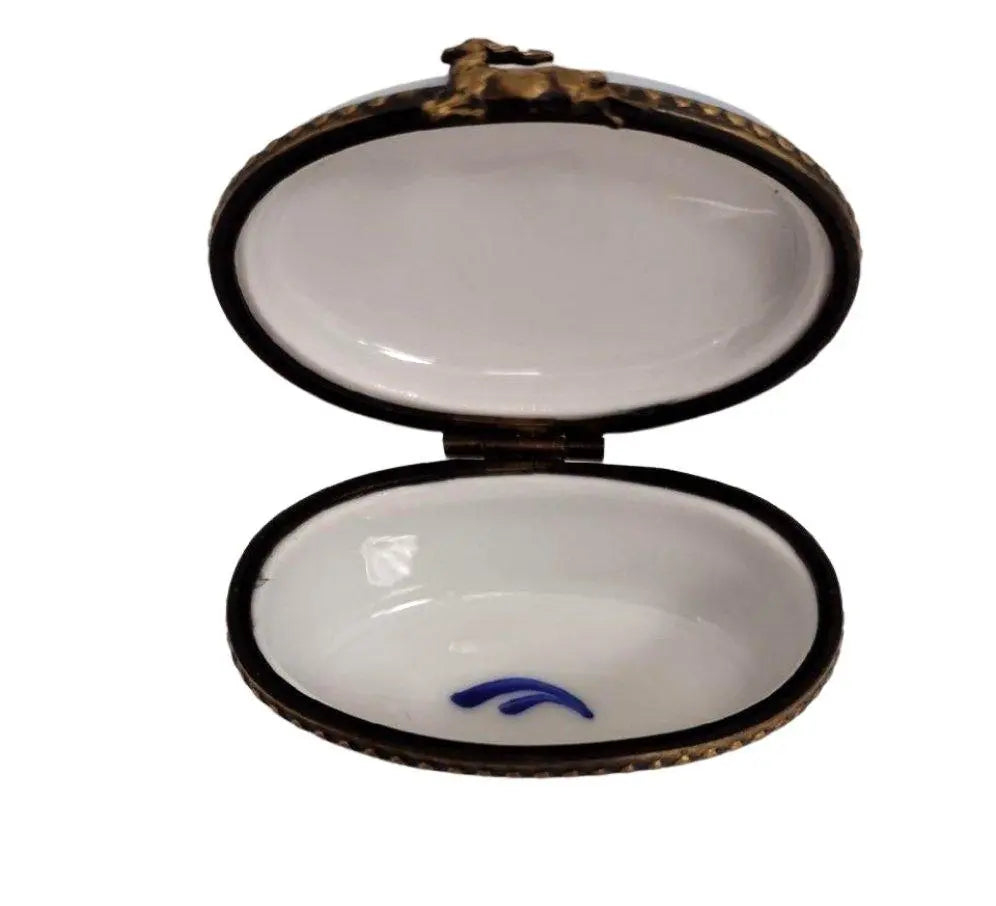 Painted details on the Santa with Snowman Oval Cheer Limoges box, French art in miniature