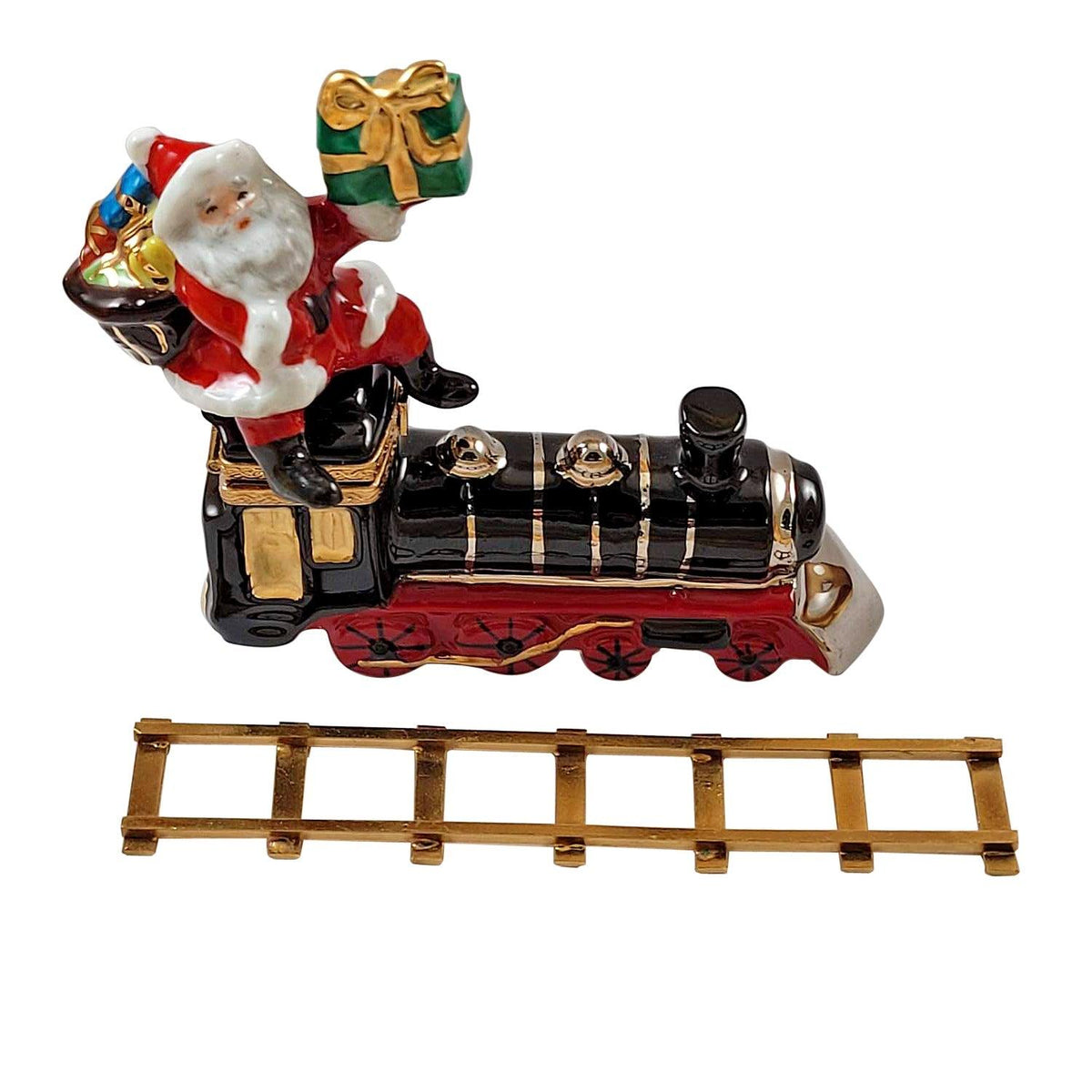 The painter's artistry shows on this Santa on Train with Brass Track Ornament Limoges box