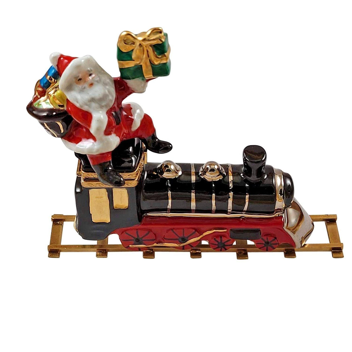 Limoges Boutique presents the Rochard Santa on Train with Brass Track Ornament