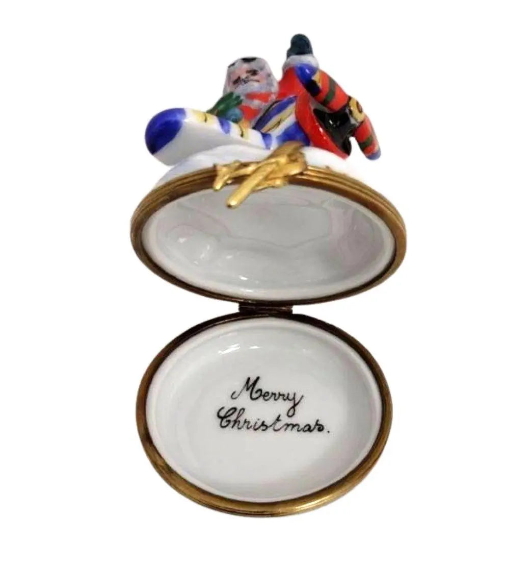 Treasured French collectible: Santa on Airplane Limoges box, painted by hand