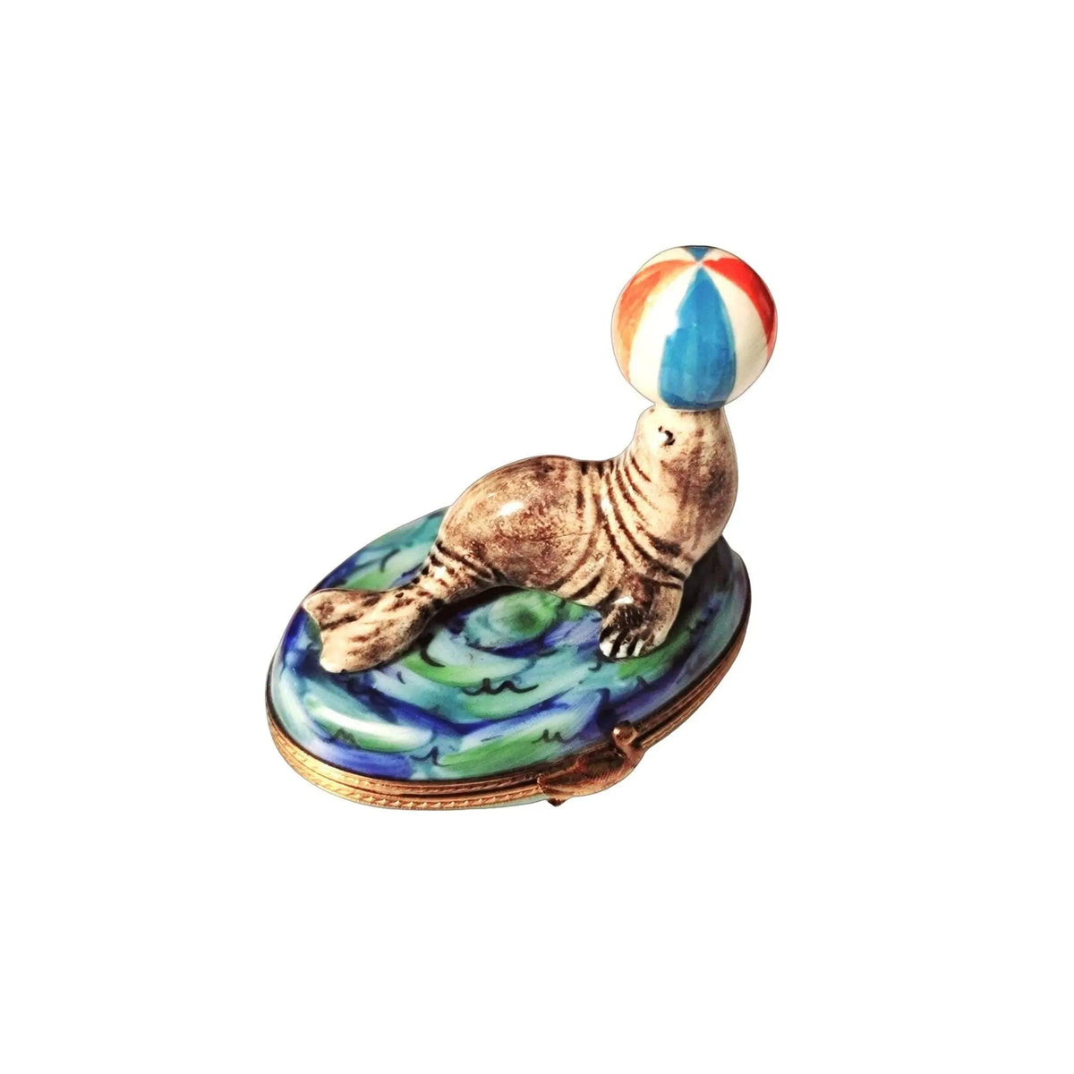 Limoges Boutique presents the Seal with Beach Ball Fish, a genuine Limoges box painted by hand in France
