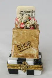 Shopping Bag with Newspaper Limoges box, an heirloom-quality piece for collectors