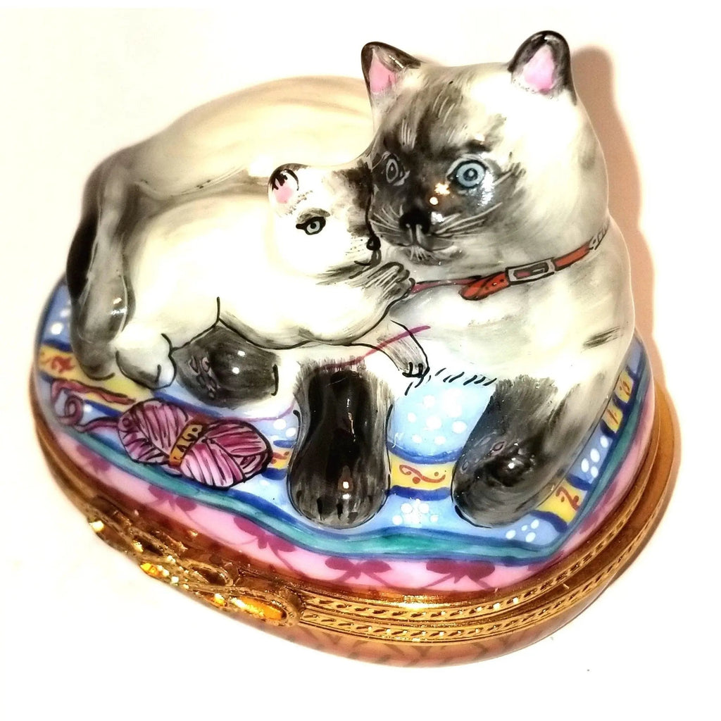 Limoges Boutique presents the Siamese Cat Kitten 1 750, a genuine Limoges box painted by hand in France