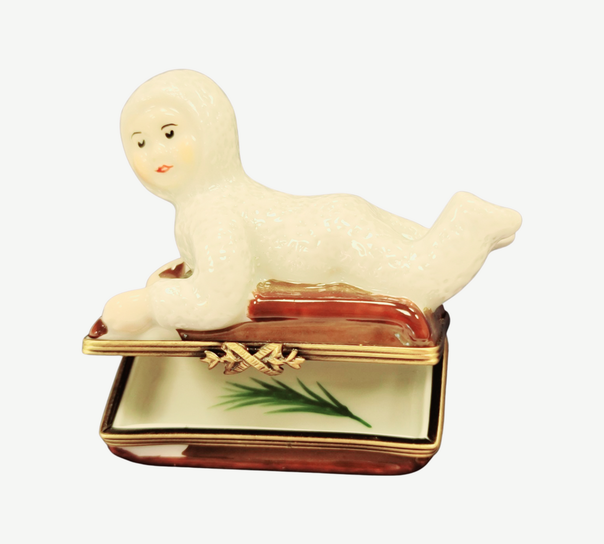 Gift idea for someone who loves France: Snow Baby Kid on Sled Winter Sleigh Limoges box